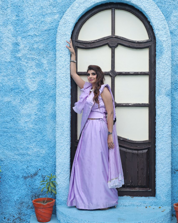 Lilac drape saree with power shoulder blouse